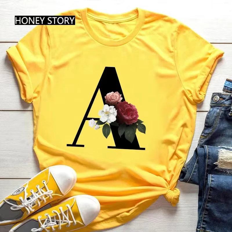 T-shirt jaune grande taille pour hommes et femmes avec imprimé tendance noir de fleurs et 26 lettres