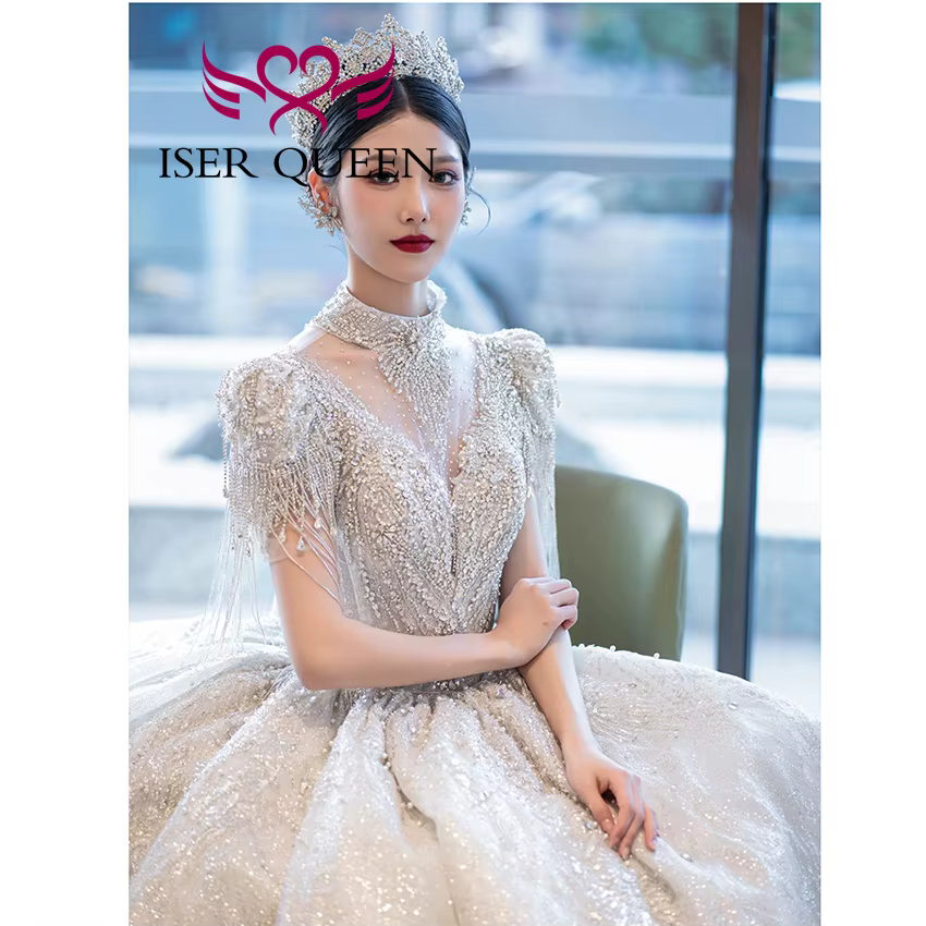 Robe de mariée de luxe personnalisée, nouvelle tendance 2026, pour femme, col montant, manches à franges, perles lourdes, robes de mariée scintillantes WX0474