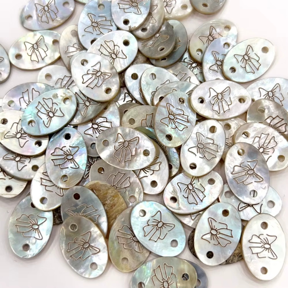 Bouton d'étiquette en coquillage exquis avec motif d'arc pour bricolage de T-shirts