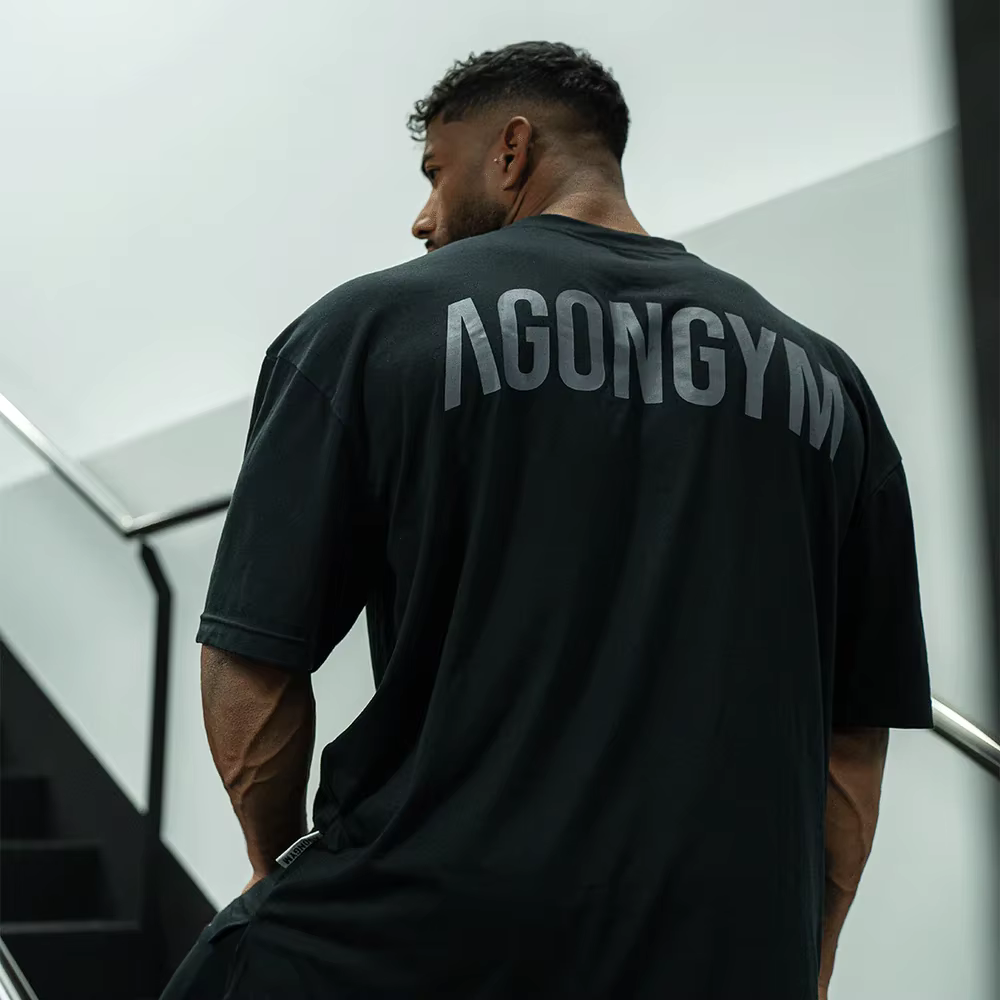 AGONGYM T-shirt Homme Oversize Imprimé Lettres en Coton Respirant pour Gym