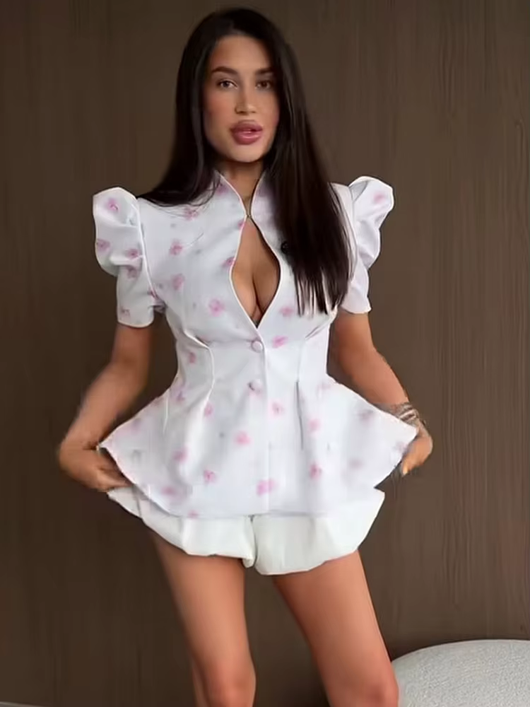 Blouse élégante à manches bouffantes florales et basque