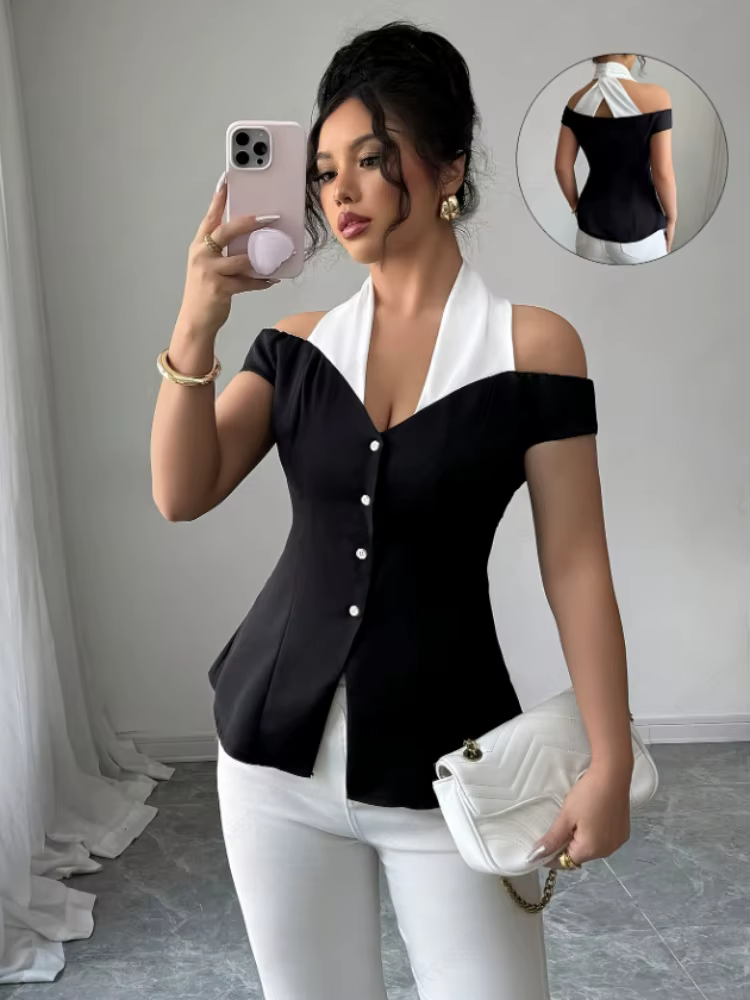 Blouse élégante noire et blanche à blocs de couleur