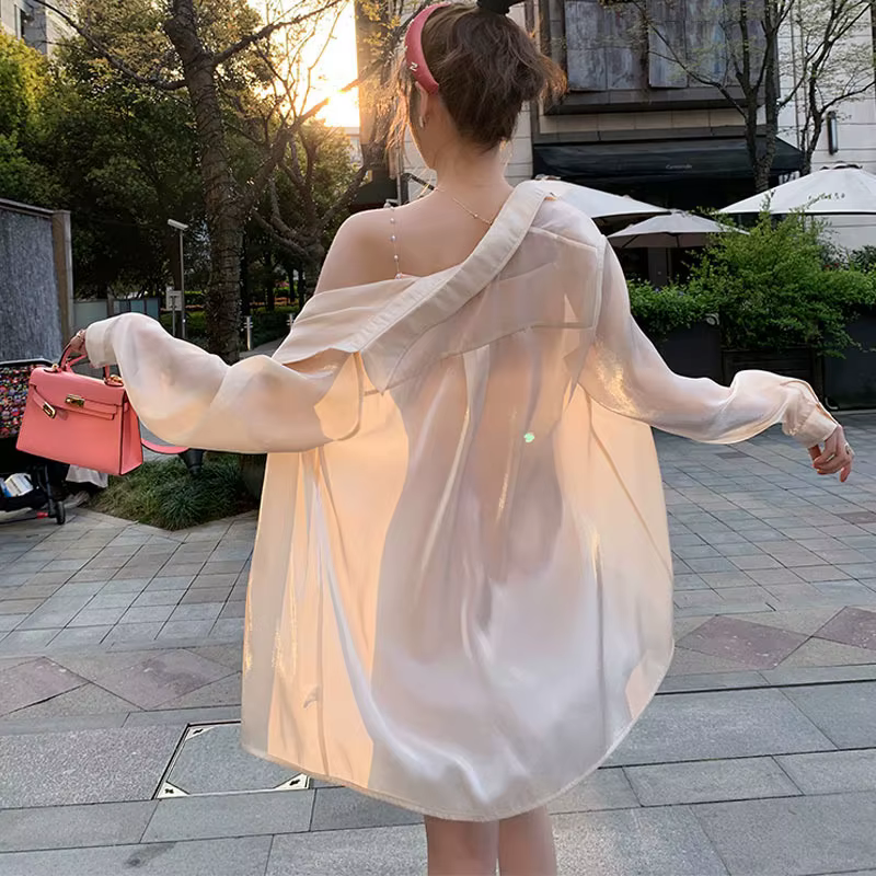 Chemise de protection solaire pour femmes, veste d'été fine et respirante, mi-longue, ample, couvrant les fesses, style décontracté, à manches longues