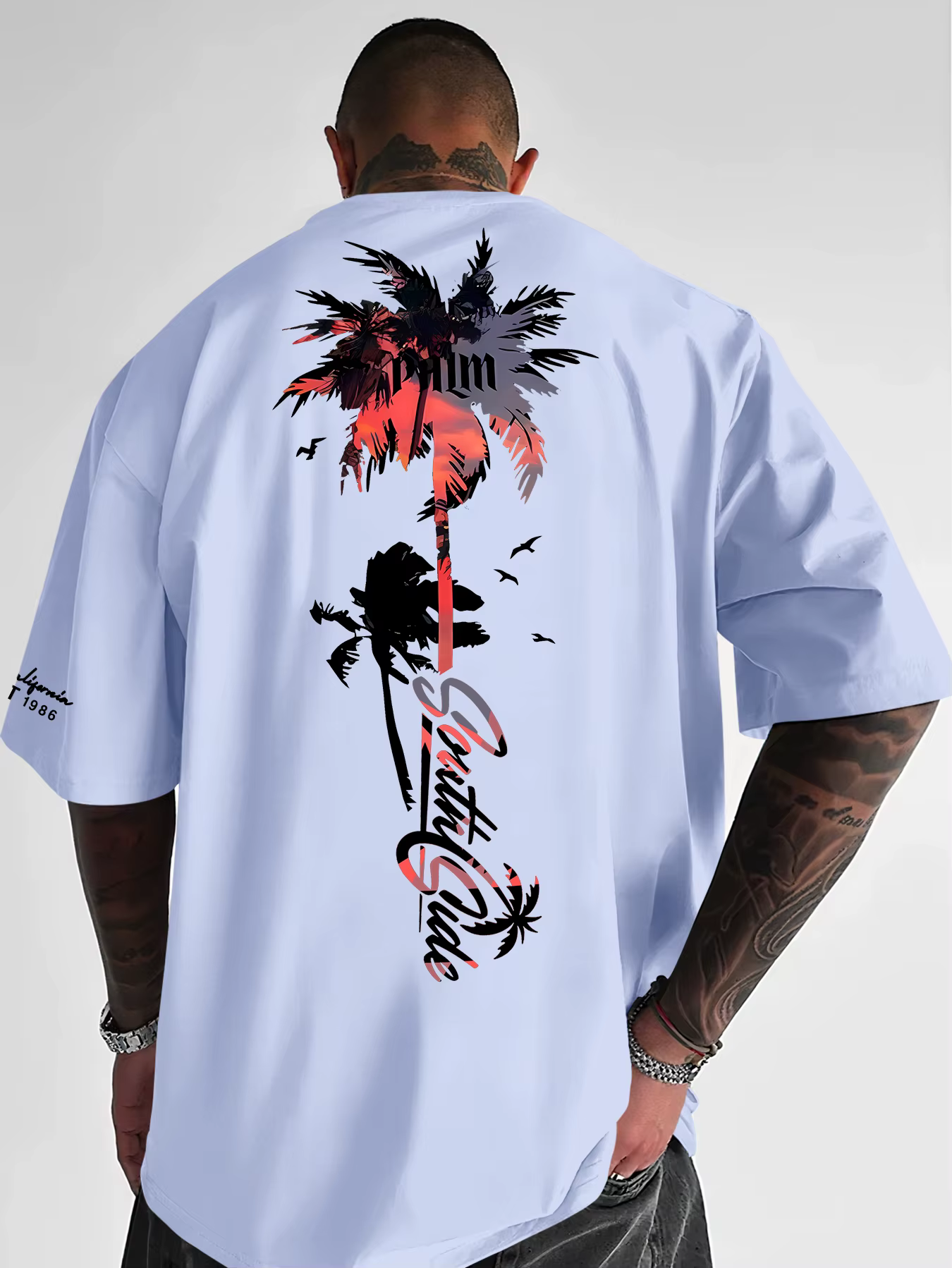 Nouveau T-shirt graphique palmier coucher de soleil tropical 2026