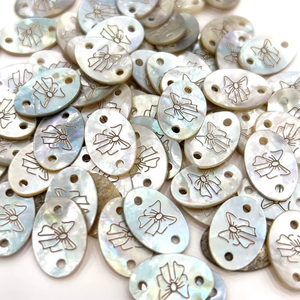 Bouton d'étiquette en coquillage exquis avec motif d'arc pour bricolage de T-shirts
