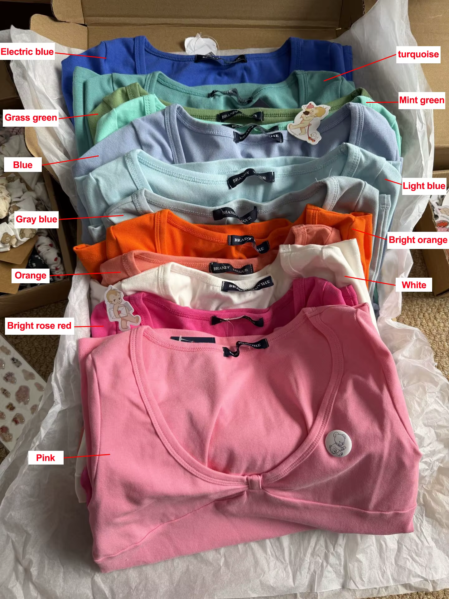 Nouveaux T-shirts roses à col en V pour femme