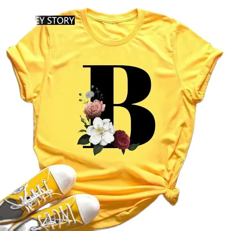 T-shirt jaune grande taille pour hommes et femmes avec imprimé tendance noir de fleurs et 26 lettres anglaises