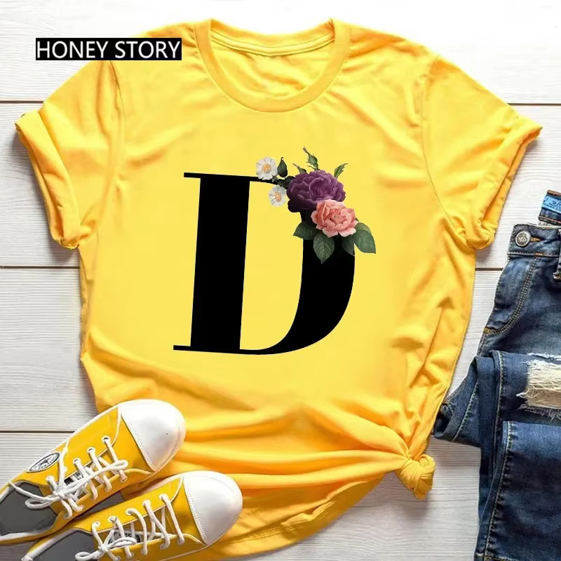 T-shirt jaune grande taille pour hommes et femmes avec imprimé tendance noir de fleurs et 26 lettres anglaises