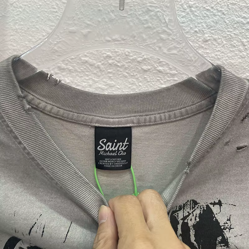 High Street sale endommagé trou dieu est un DJ débardeurs hommes femmes surdimensionné Saint manches-coupées T-Shirt