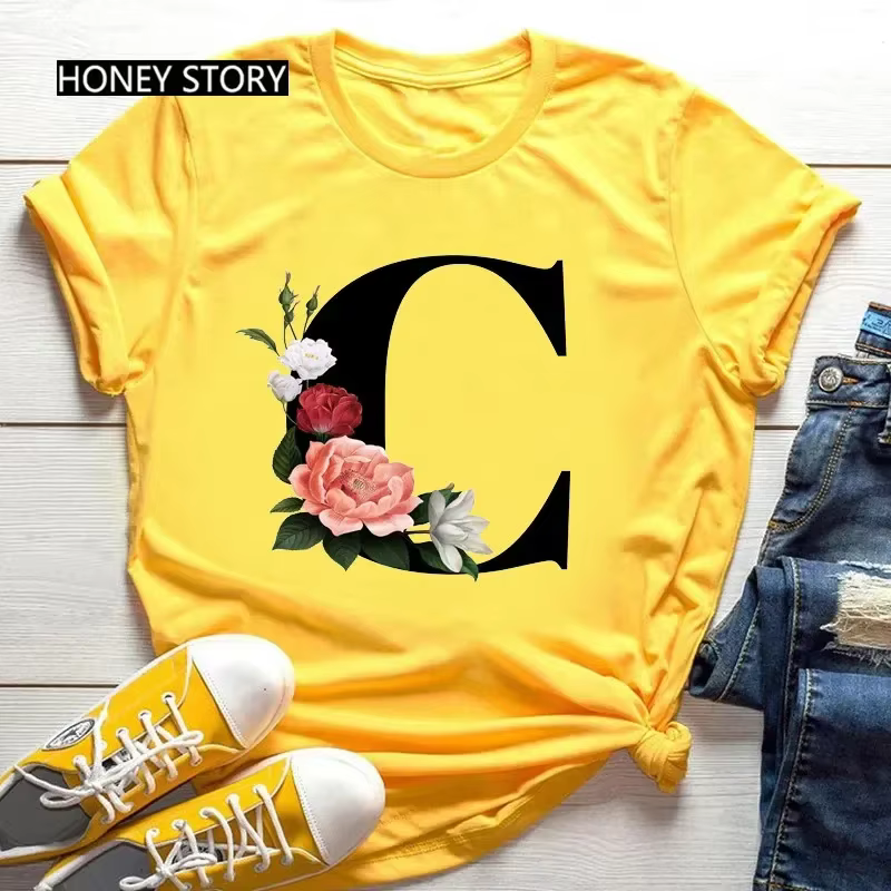 T-shirt jaune grande taille pour hommes et femmes avec imprimé tendance noir de fleurs et 26 lettres anglaises