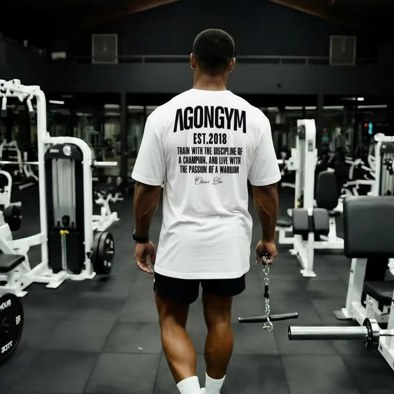 AGONGYM nouvelle tendance de la mode hommes T-shirt sport coton manches courtes chemises amples musculation Fitness